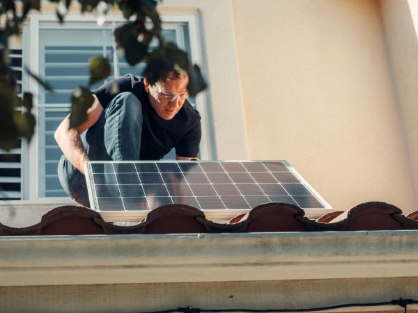 Man installing solar panel Pexels