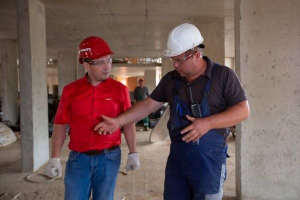 Two men at a construction site 600 Pexels