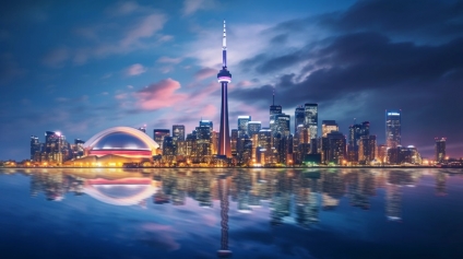 A city skyline of Toronto at night, the location of many top property management companies. 
